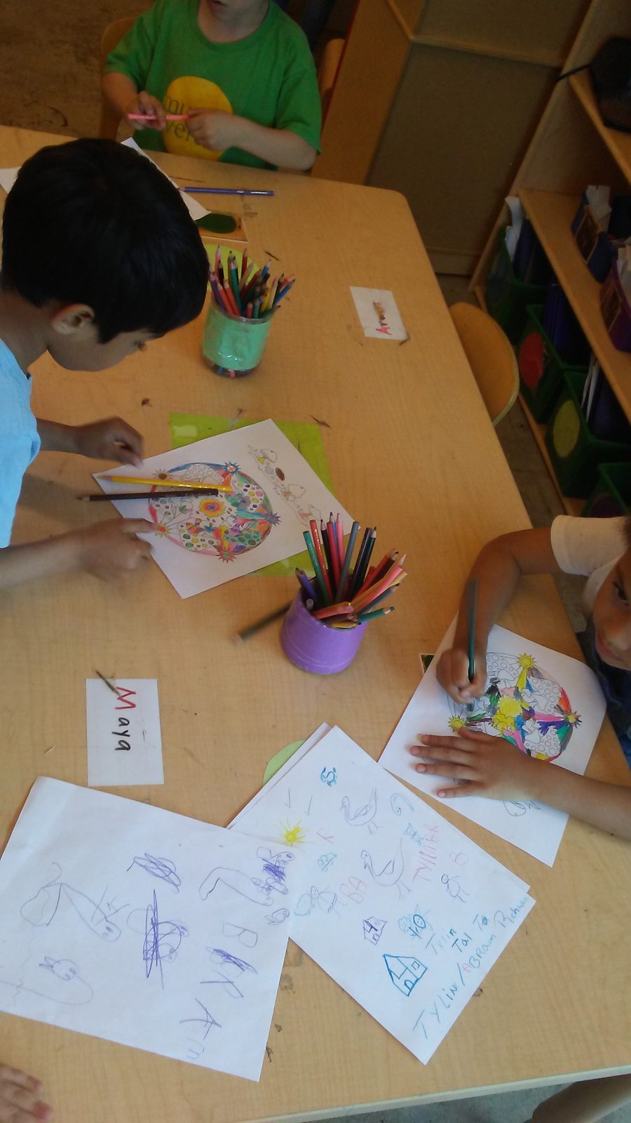 Kids coloring together in after-school Spanish class